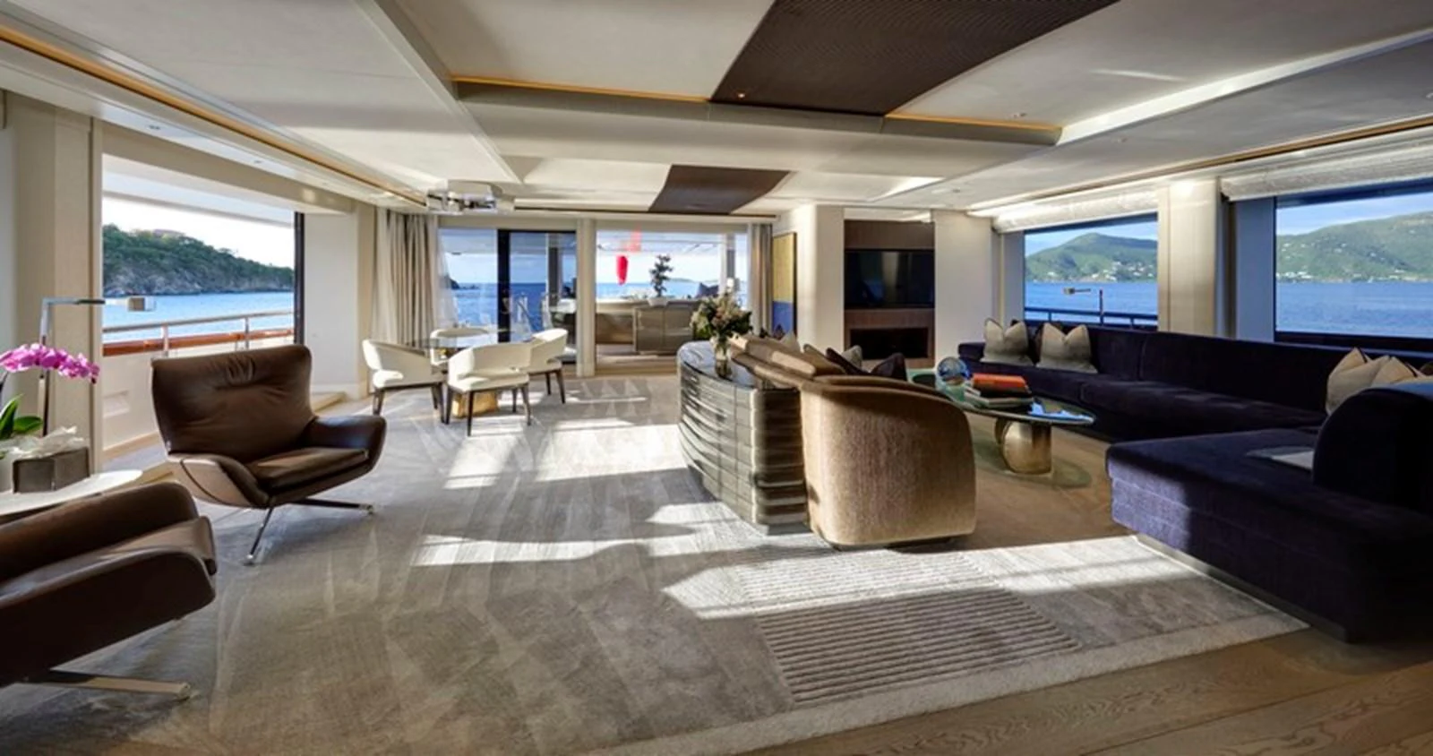 a living room with leather couches aboard VANISH Yacht for Sale