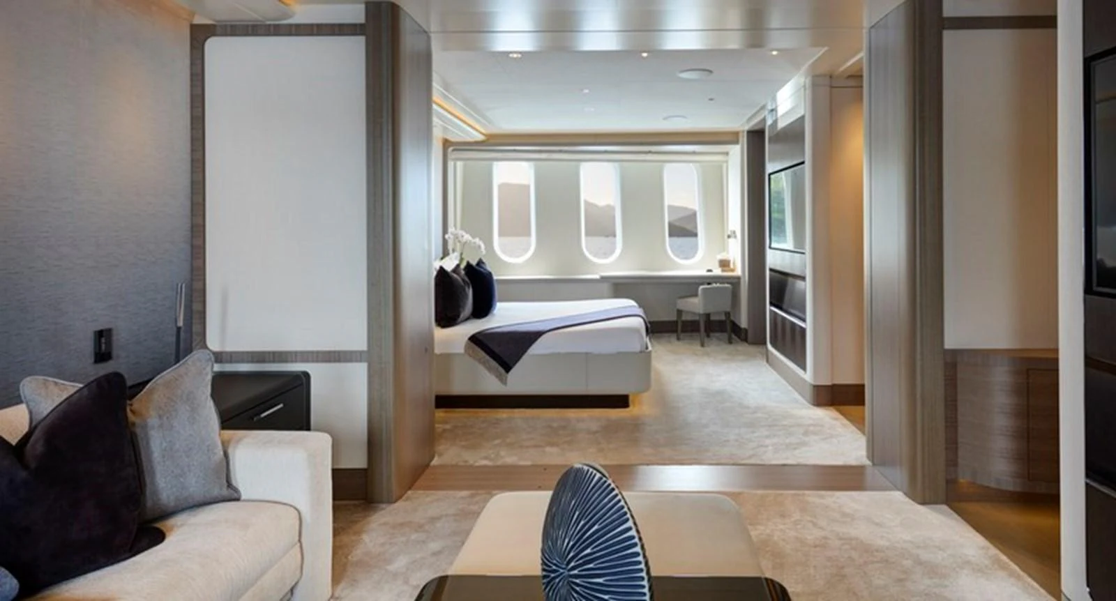 a room with a bed and a couch aboard VANISH Yacht for Sale