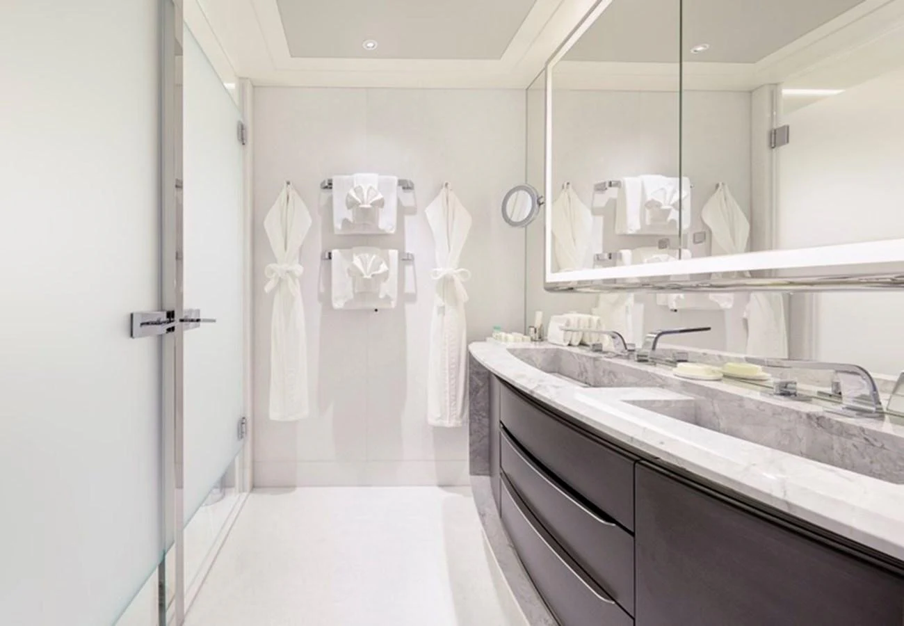 a bathroom with a sink and a mirror aboard VANISH Yacht for Sale