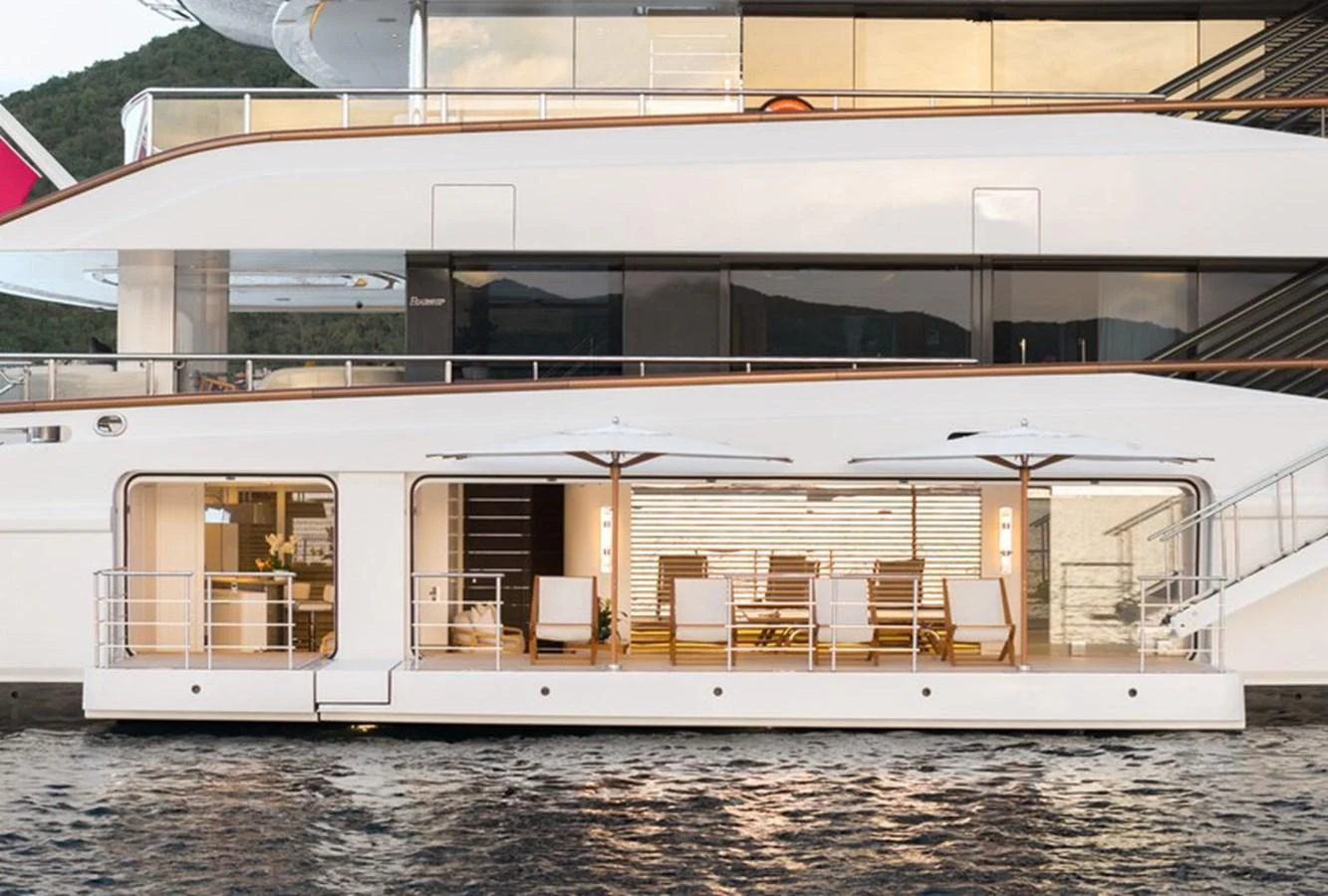 a building with chairs and tables aboard VANISH Yacht for Sale