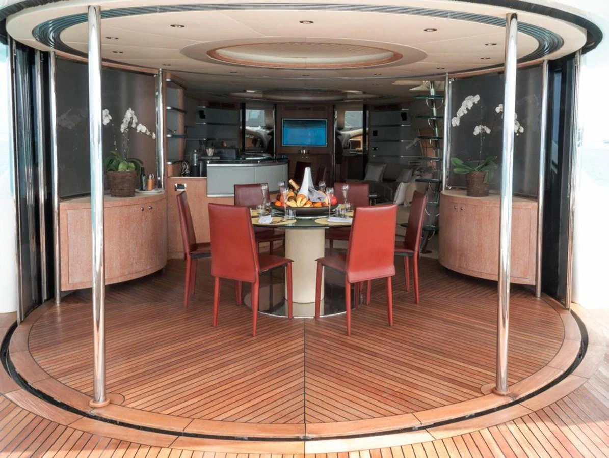 a room with a table and chairs aboard AZIMUT 98 LEONARDO Yacht for Sale