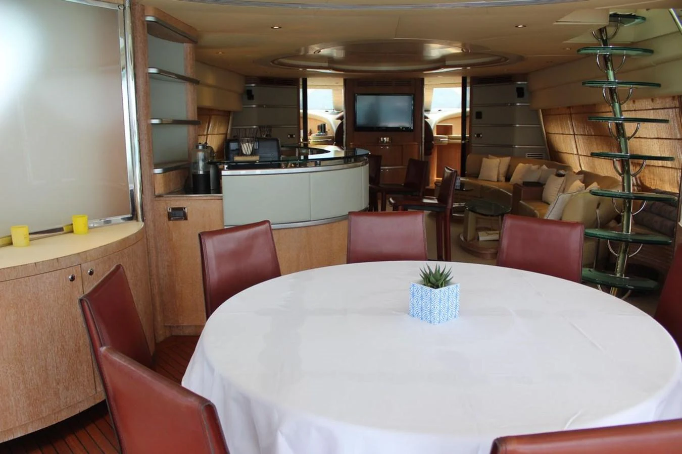 a dining table in a room aboard AZIMUT 98 LEONARDO Yacht for Sale