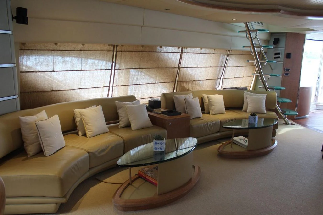 a living room with a couch and a table aboard AZIMUT 98 LEONARDO Yacht for Sale