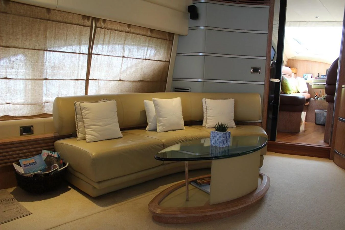 a living room with a couch and a coffee table aboard AZIMUT 98 LEONARDO Yacht for Sale