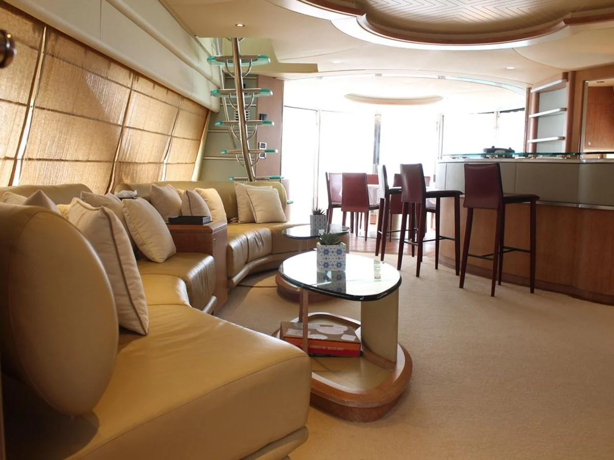 a living room with a couch and a table aboard AZIMUT 98 LEONARDO Yacht for Sale
