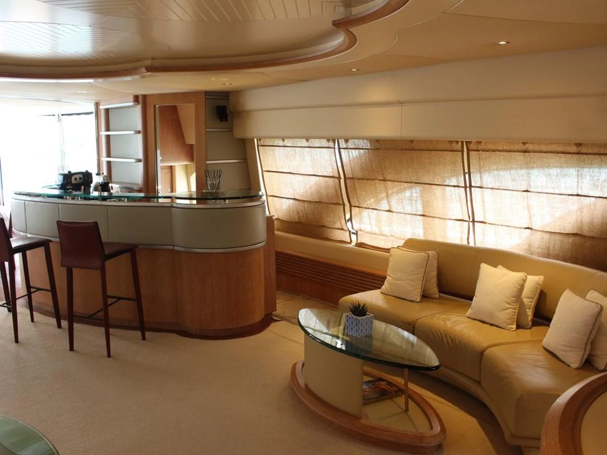 a living room with a couch and a table aboard AZIMUT 98 LEONARDO Yacht for Sale