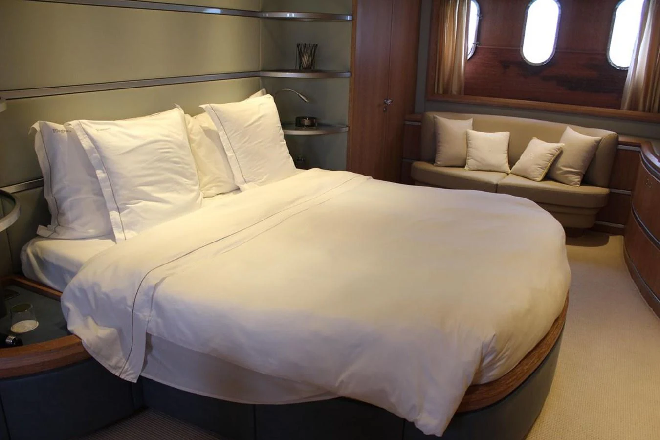 a bed with white sheets aboard AZIMUT 98 LEONARDO Yacht for Sale