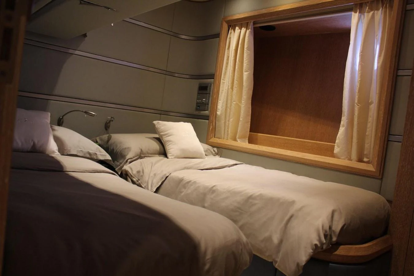 a couple of beds in a room aboard AZIMUT 98 LEONARDO Yacht for Sale