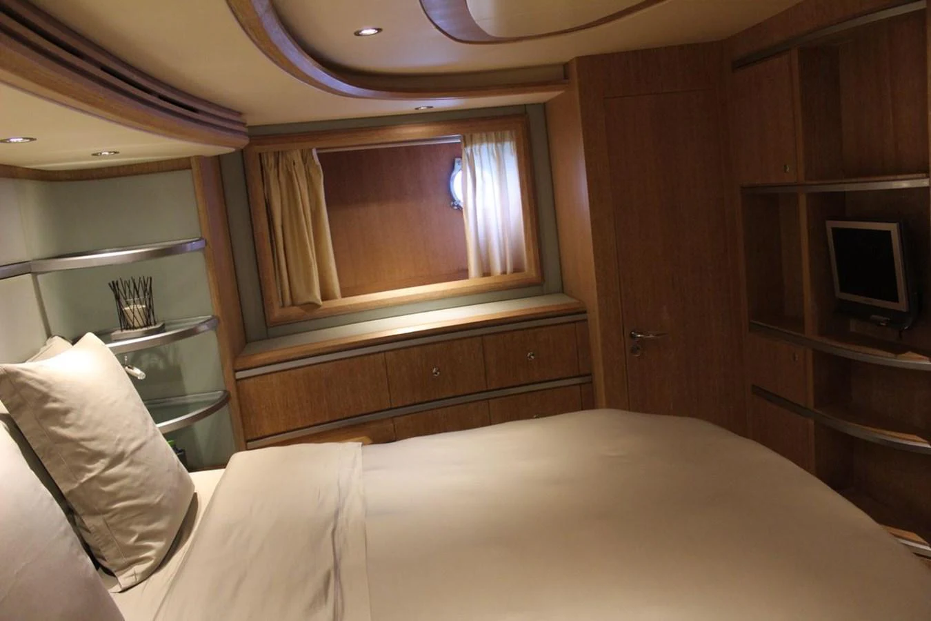 a bed in a room aboard AZIMUT 98 LEONARDO Yacht for Sale