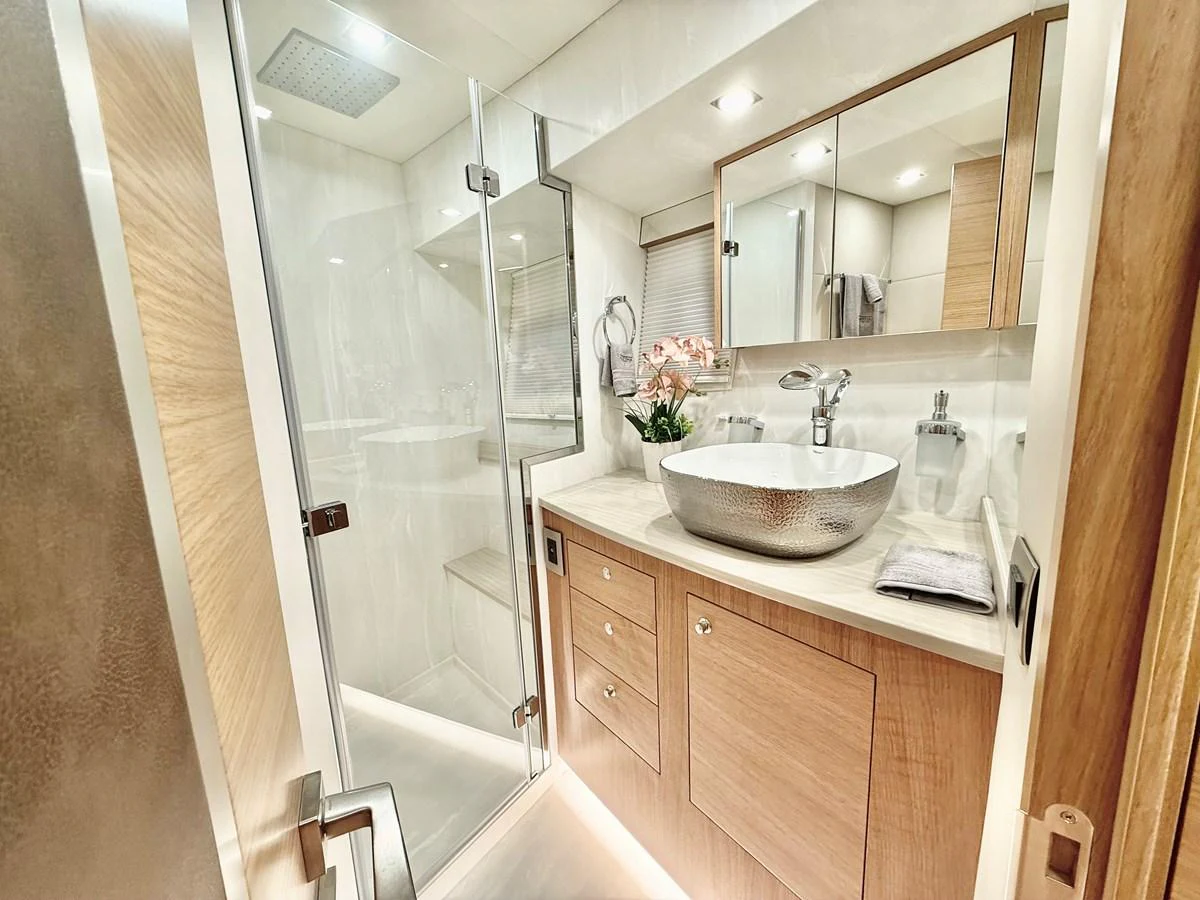 a bathroom with a sink and a mirror aboard SEA AT LAST Yacht for Sale