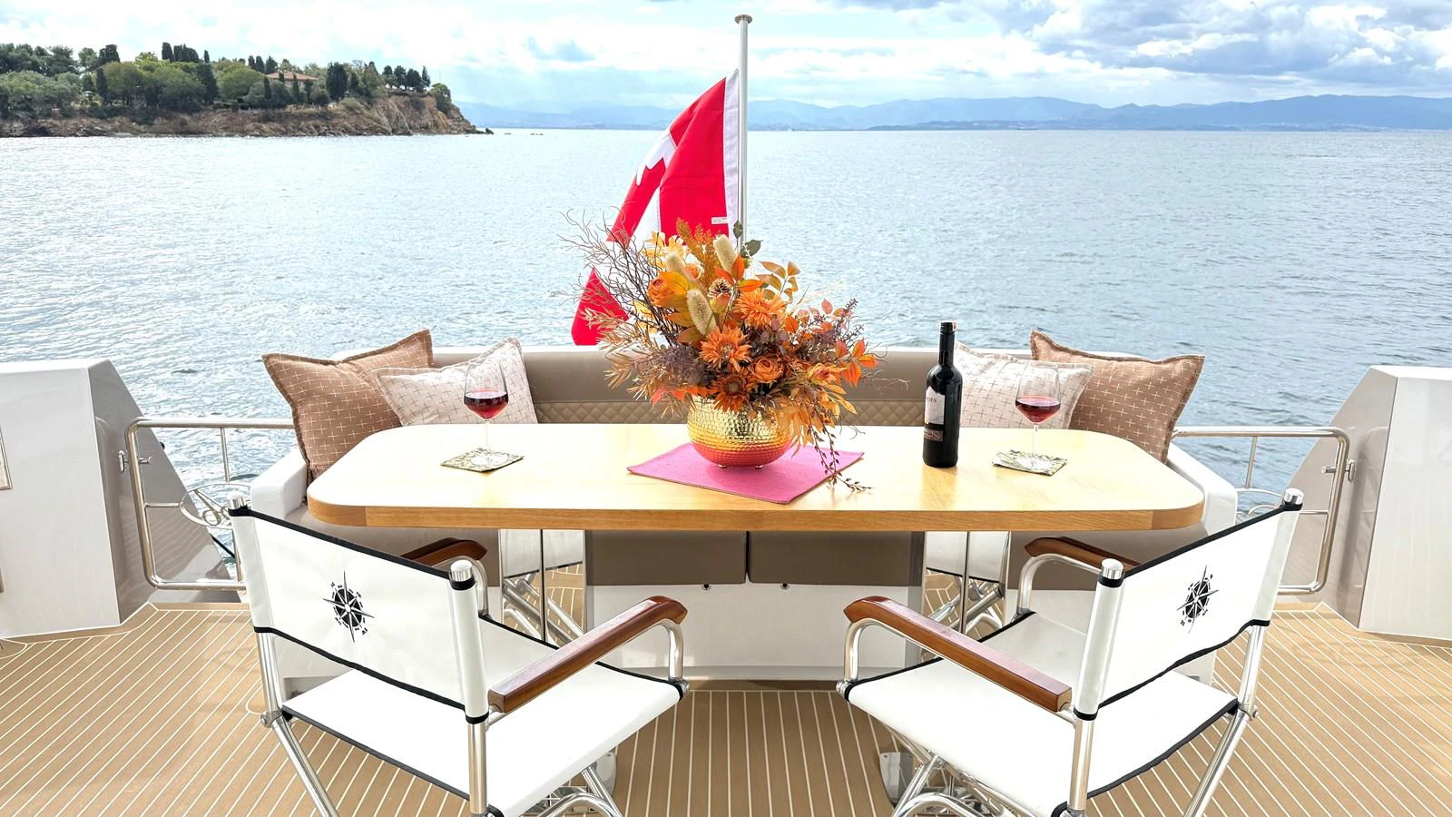 a table with a flower on it aboard SEA AT LAST Yacht for Sale