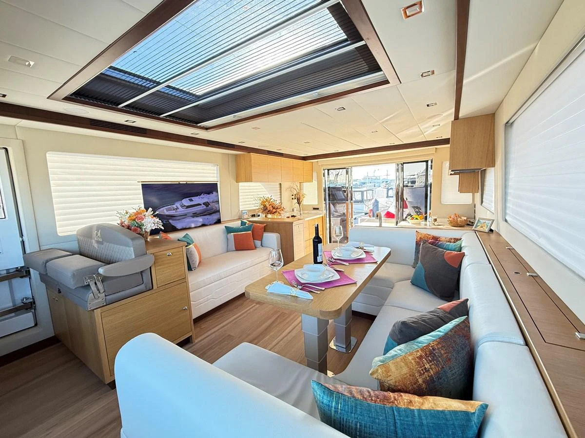 a living room with a large ceiling aboard SEA AT LAST Yacht for Sale