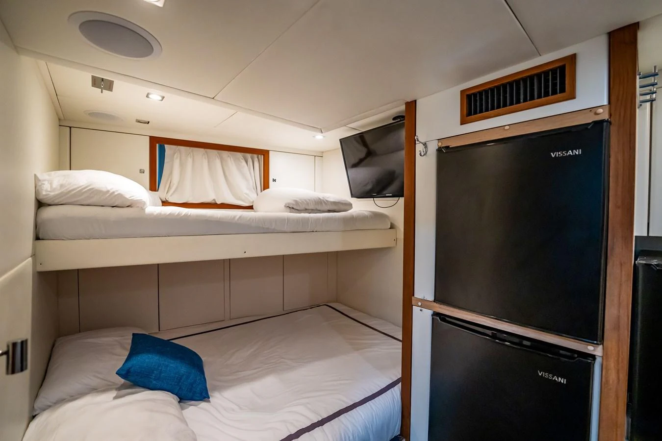 a room with a bed and a desk aboard PRECIOSO Yacht for Sale