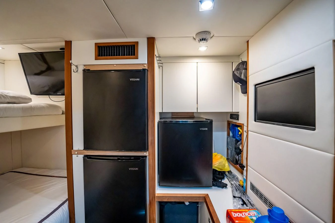 a small refrigerator and microwave in a small kitchen aboard PRECIOSO Yacht for Sale