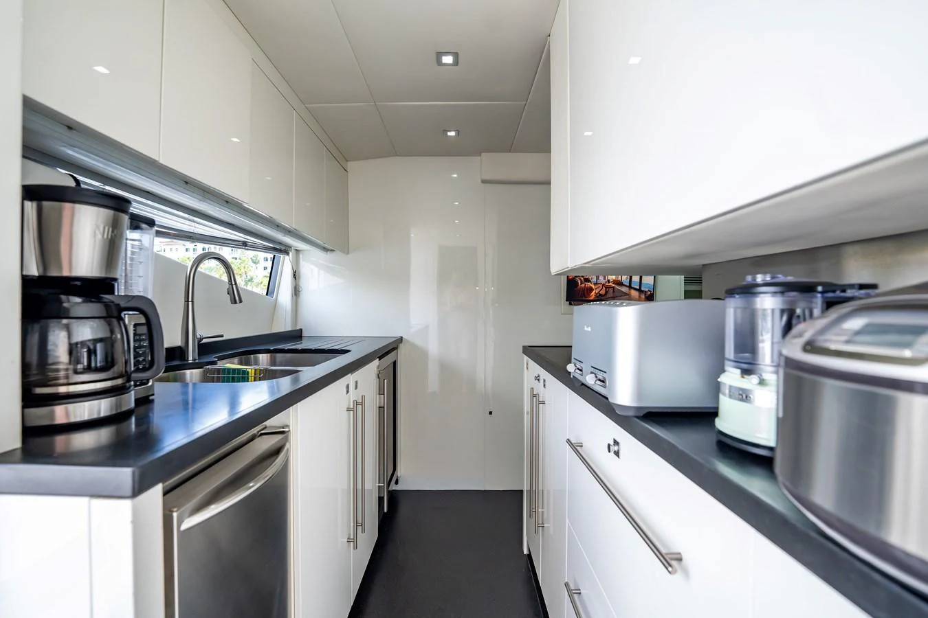 a kitchen with stainless steel appliances aboard PRECIOSO Yacht for Sale