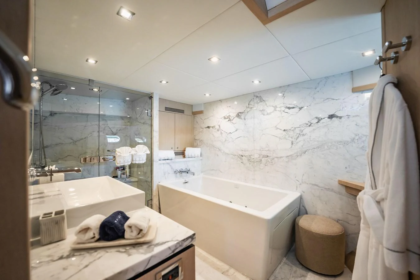 a bathroom with a tub and shower aboard PRECIOSO Yacht for Sale
