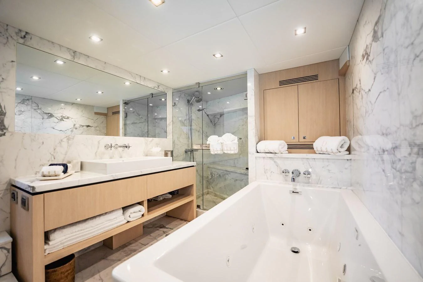 a bathroom with a large bathtub aboard PRECIOSO Yacht for Sale