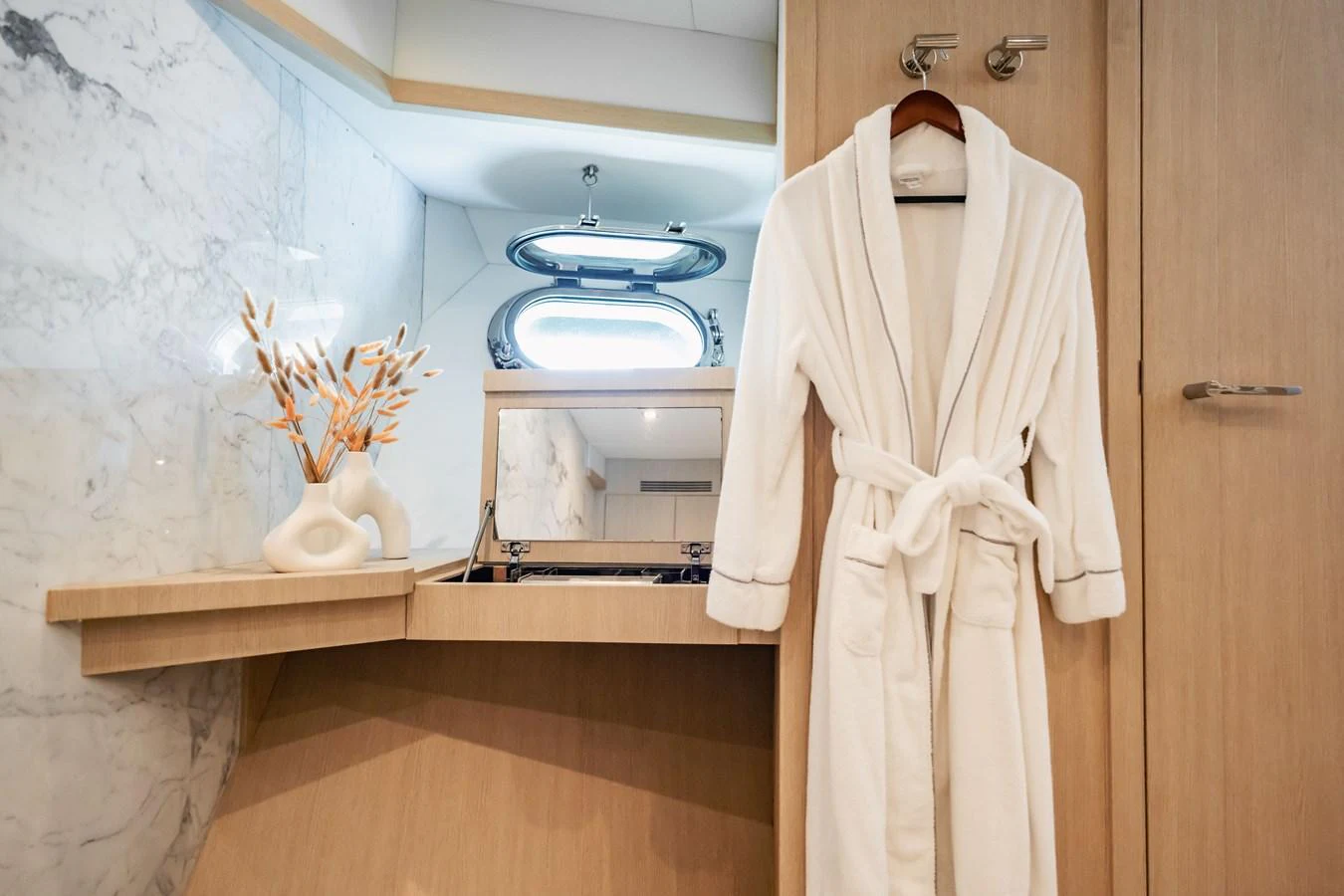 a white robe on a door aboard PRECIOSO Yacht for Sale
