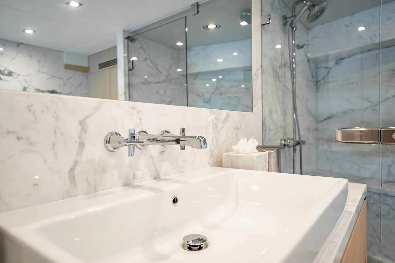 a bathroom with a large mirror aboard PRECIOSO Yacht for Sale