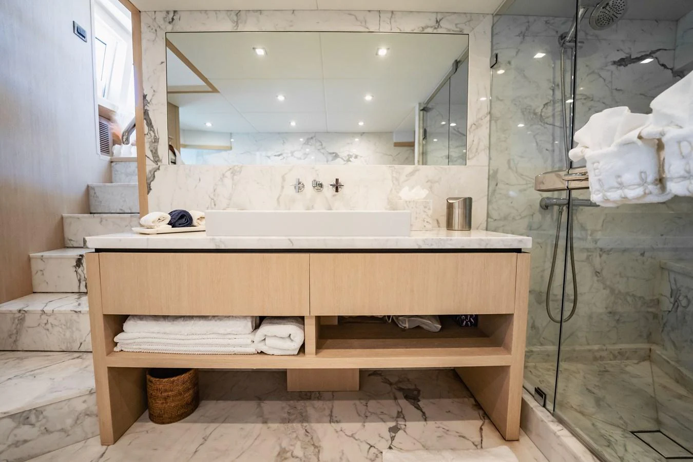 a bathroom with a sink and a mirror aboard PRECIOSO Yacht for Sale