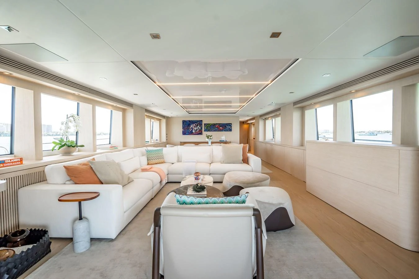 a living room with a couch and a table aboard PRECIOSO Yacht for Sale