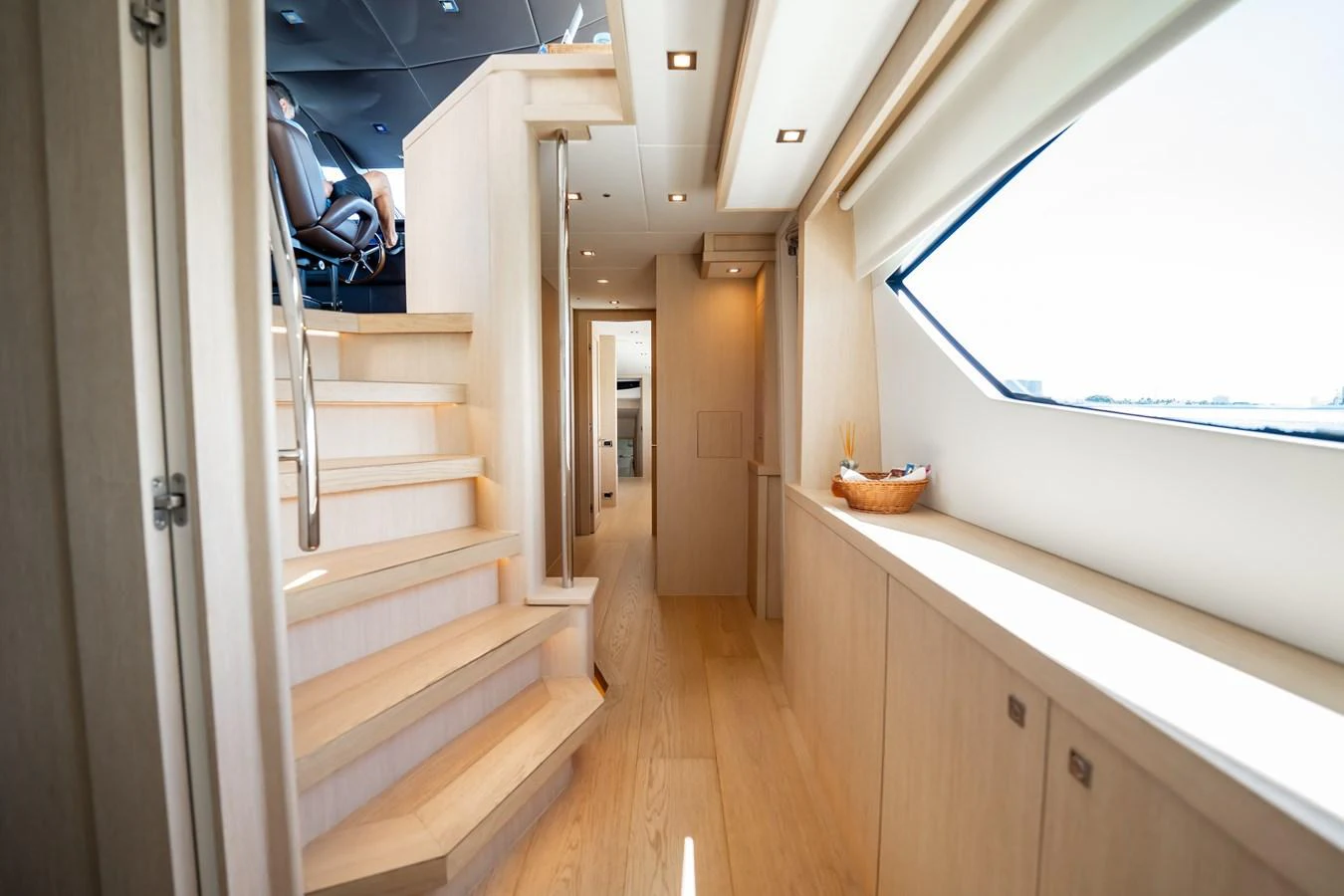 a long hallway with white walls aboard PRECIOSO Yacht for Sale