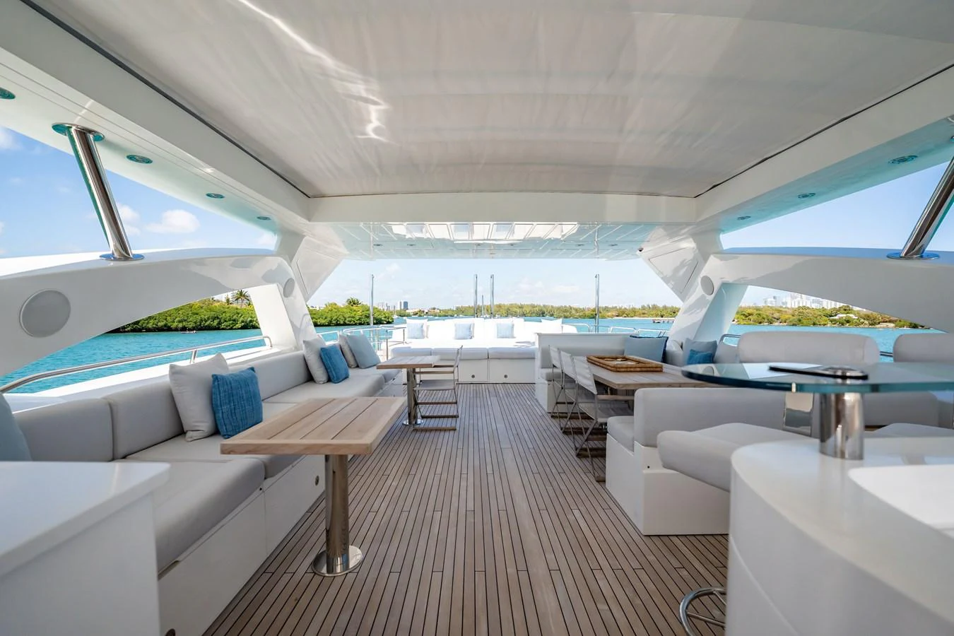 a room with a couch and a table and a pool aboard PRECIOSO Yacht for Sale