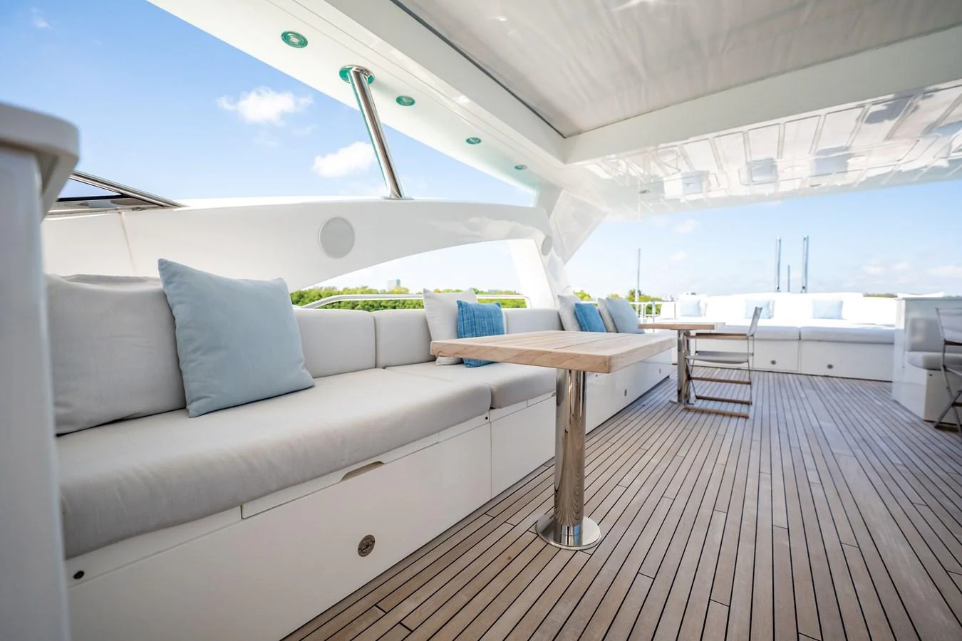 a white couch in a room aboard PRECIOSO Yacht for Sale