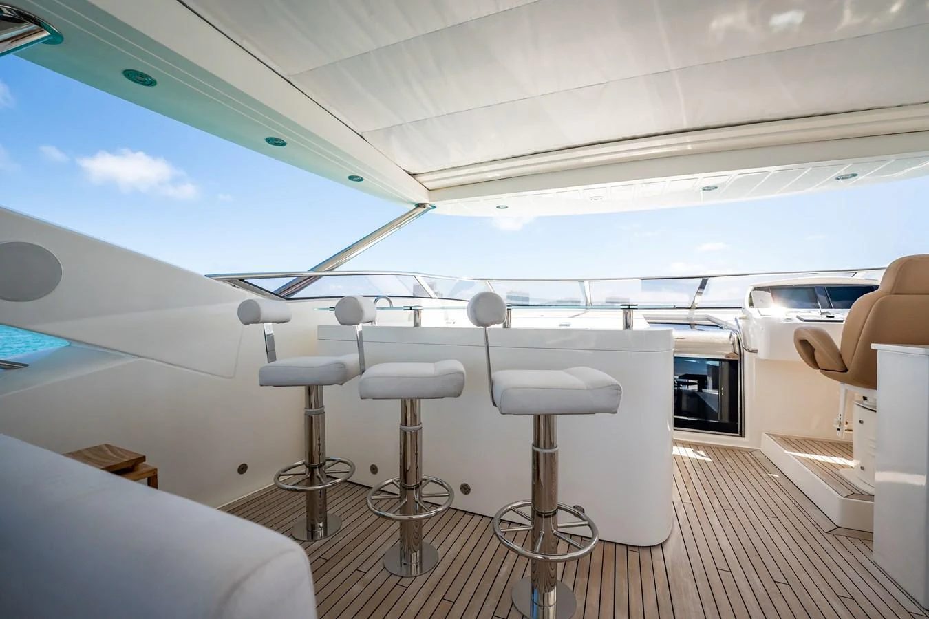 a room with a table and chairs aboard PRECIOSO Yacht for Sale