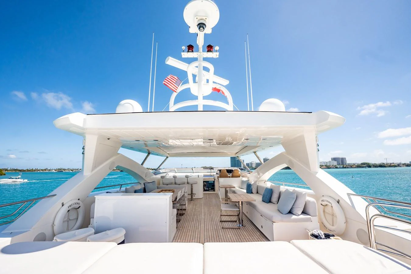 a large white ship with a flag on it aboard PRECIOSO Yacht for Sale