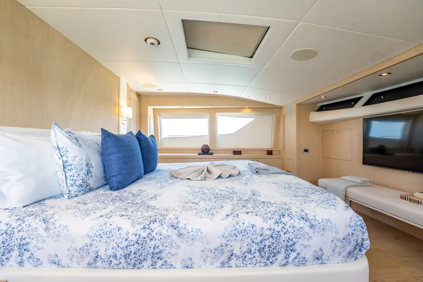 a room with a bed and a television aboard PRECIOSO Yacht for Sale