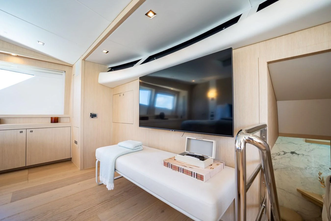 a room with a bed and a mirror aboard PRECIOSO Yacht for Sale