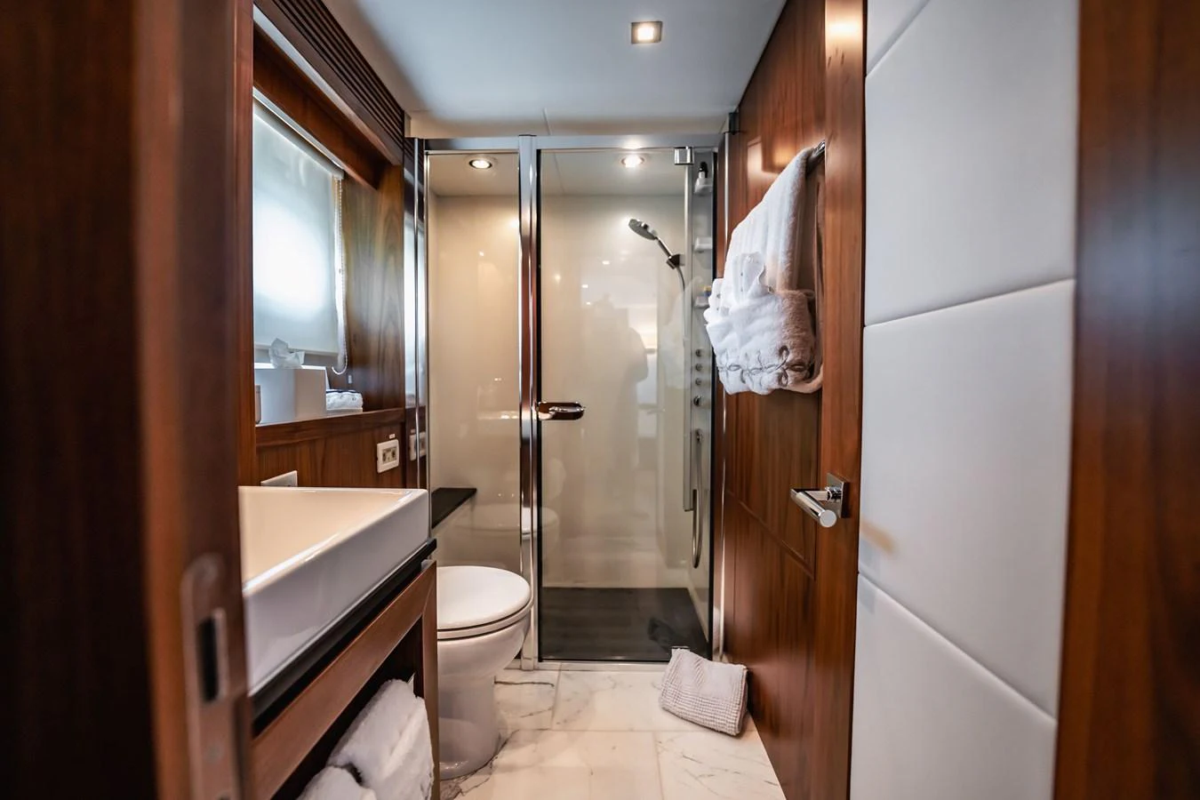 a bathroom with a shower unit and toilet aboard PRECIOSO Yacht for Sale