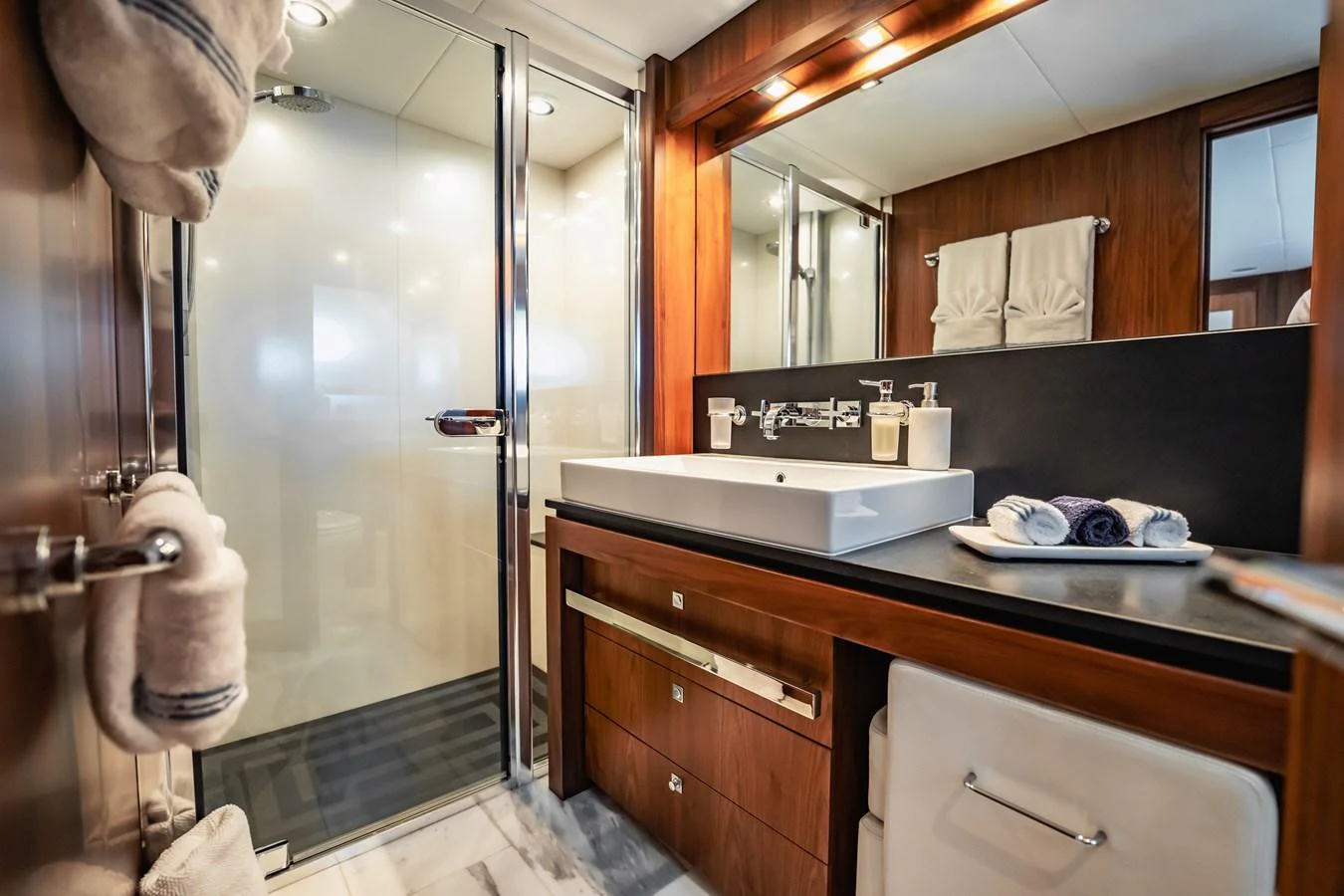 a bathroom with a glass shower aboard PRECIOSO Yacht for Sale