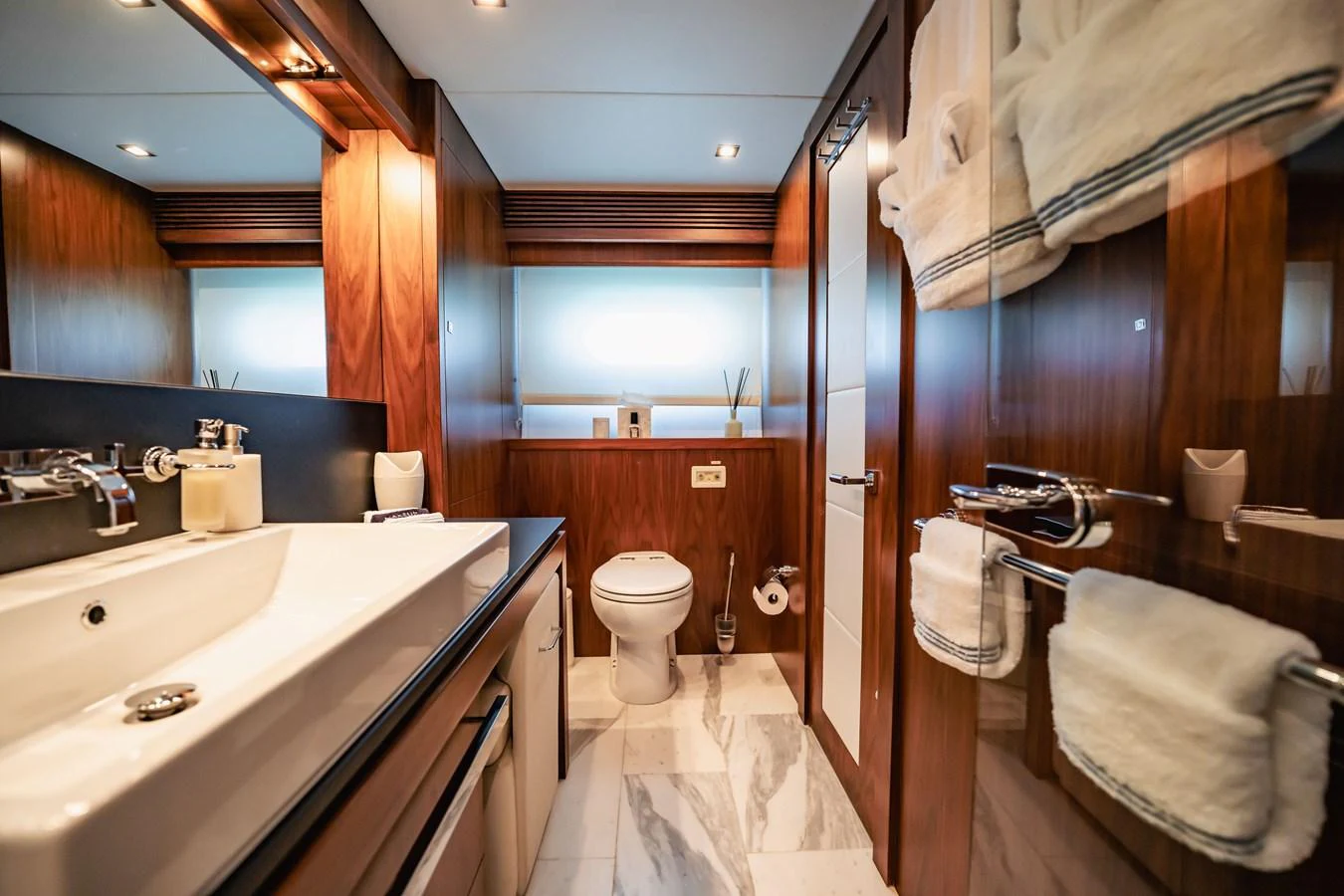 a bathroom with a sink toilet and a bathtub aboard PRECIOSO Yacht for Sale