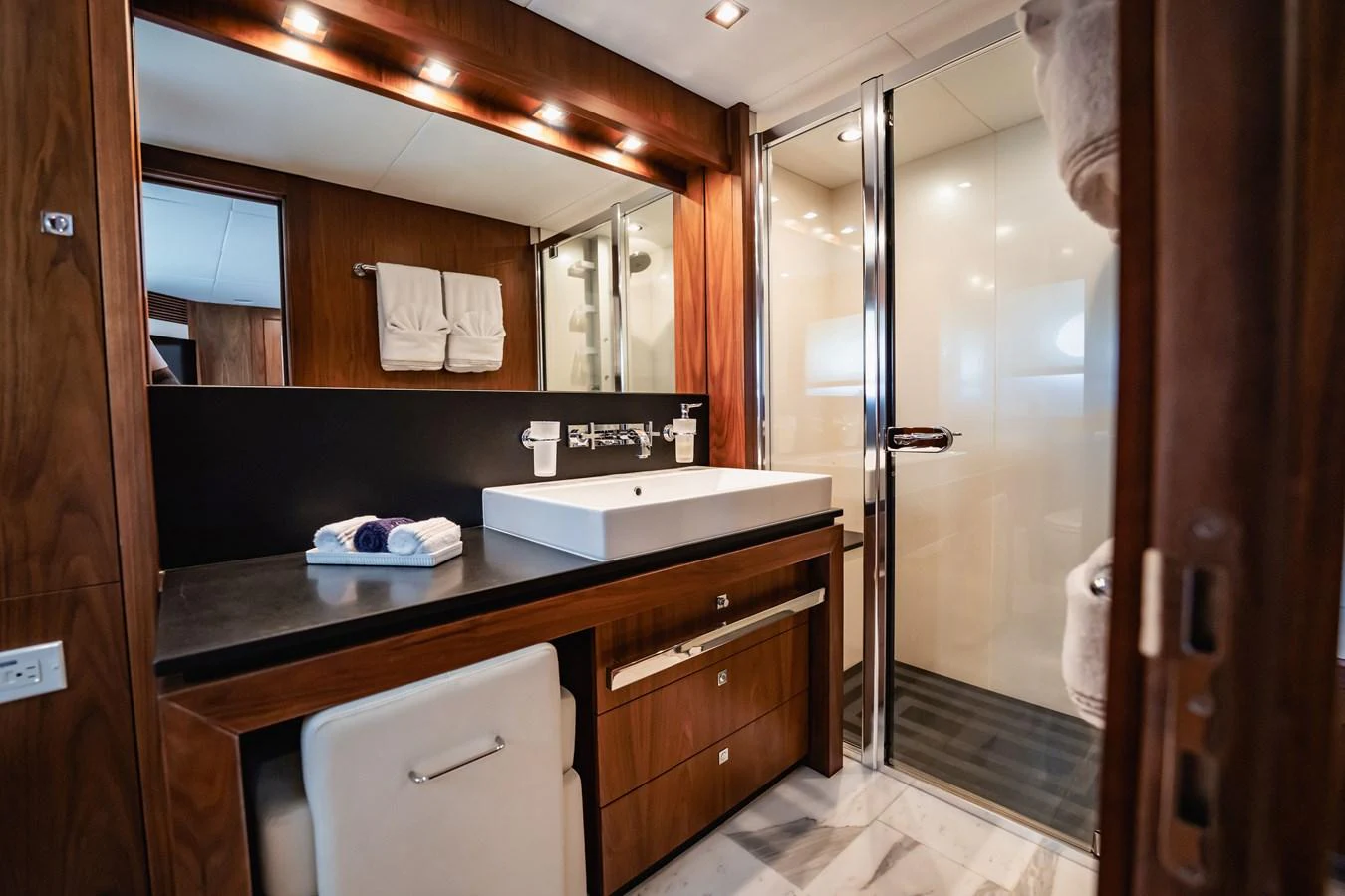a bathroom with a large mirror aboard PRECIOSO Yacht for Sale