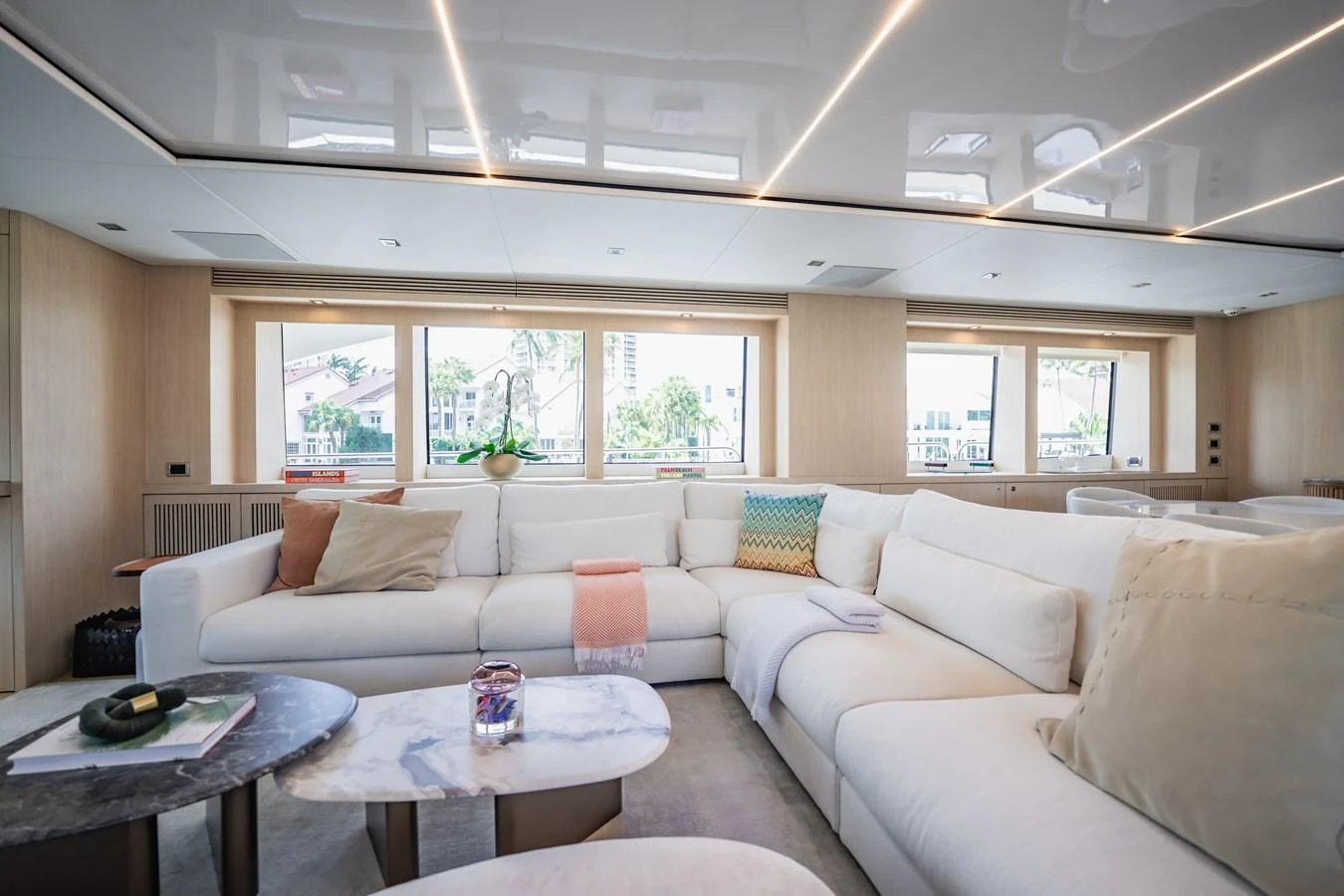 a living room with a couch and a table aboard PRECIOSO Yacht for Sale
