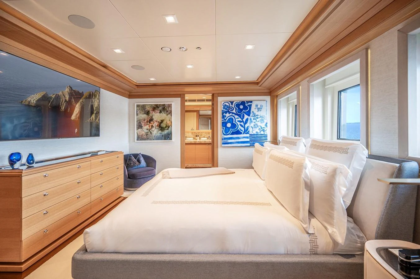 a bedroom with a large bed aboard ODYSSEY Yacht for Sale