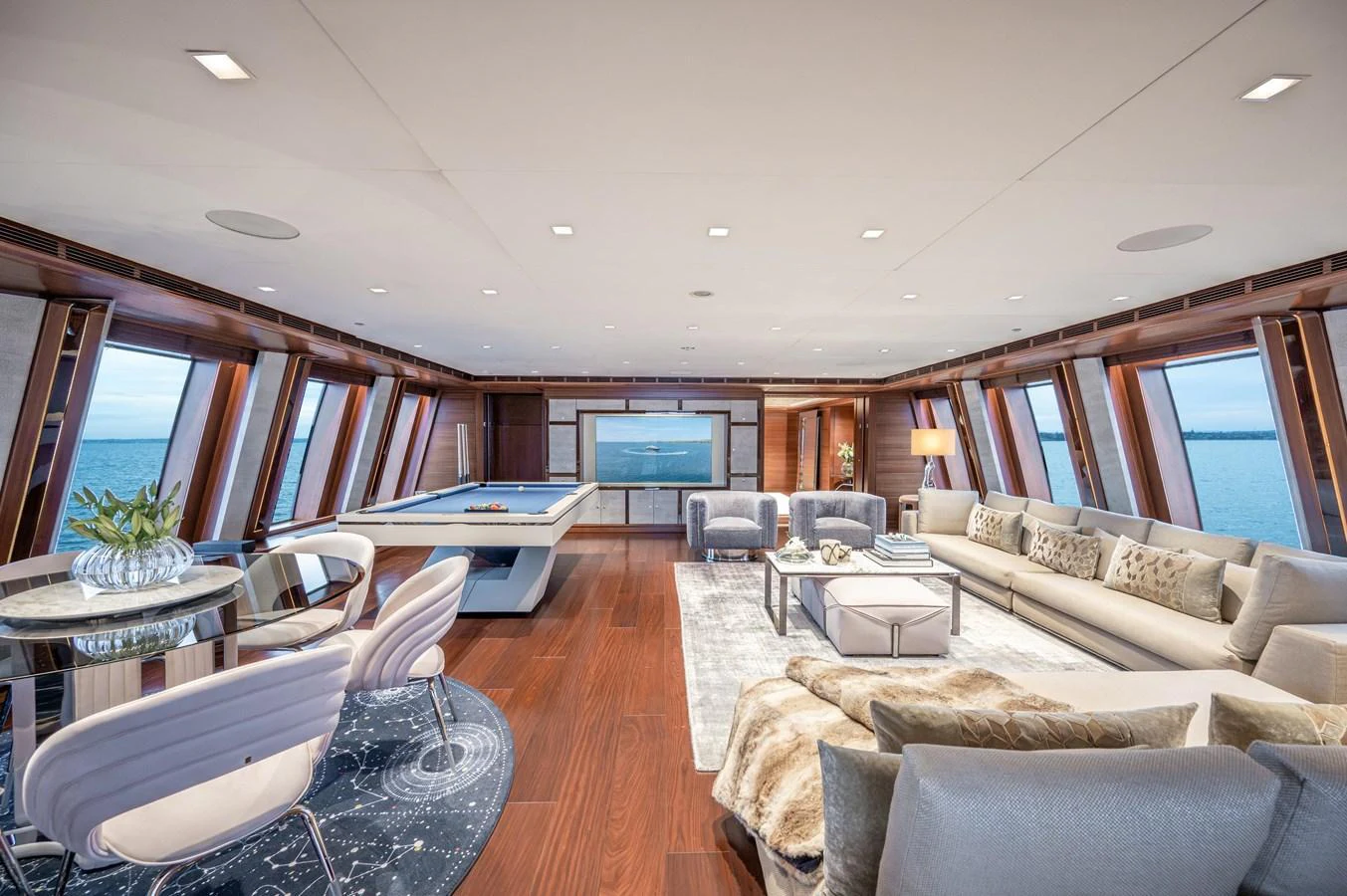 a living room with a large window aboard ODYSSEY Yacht for Sale
