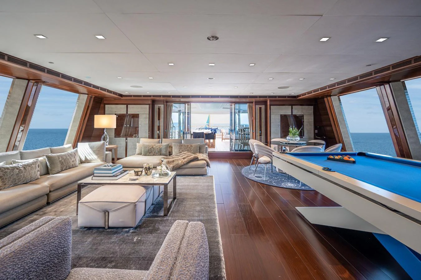 a living room with a large swimming pool aboard ODYSSEY Yacht for Sale