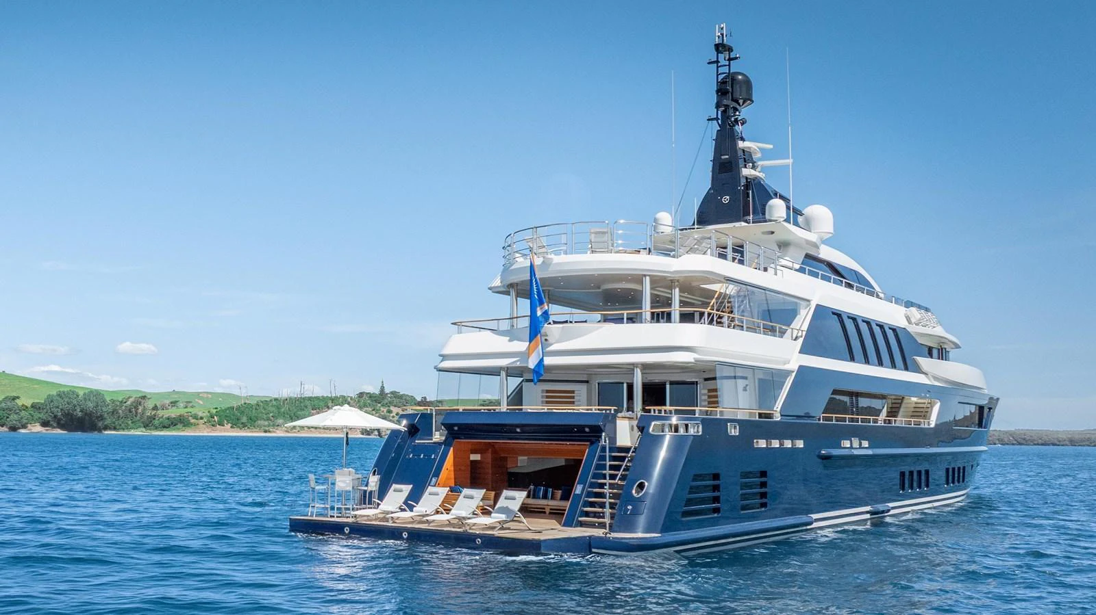 a large white boat on the water aboard ODYSSEY Yacht for Sale