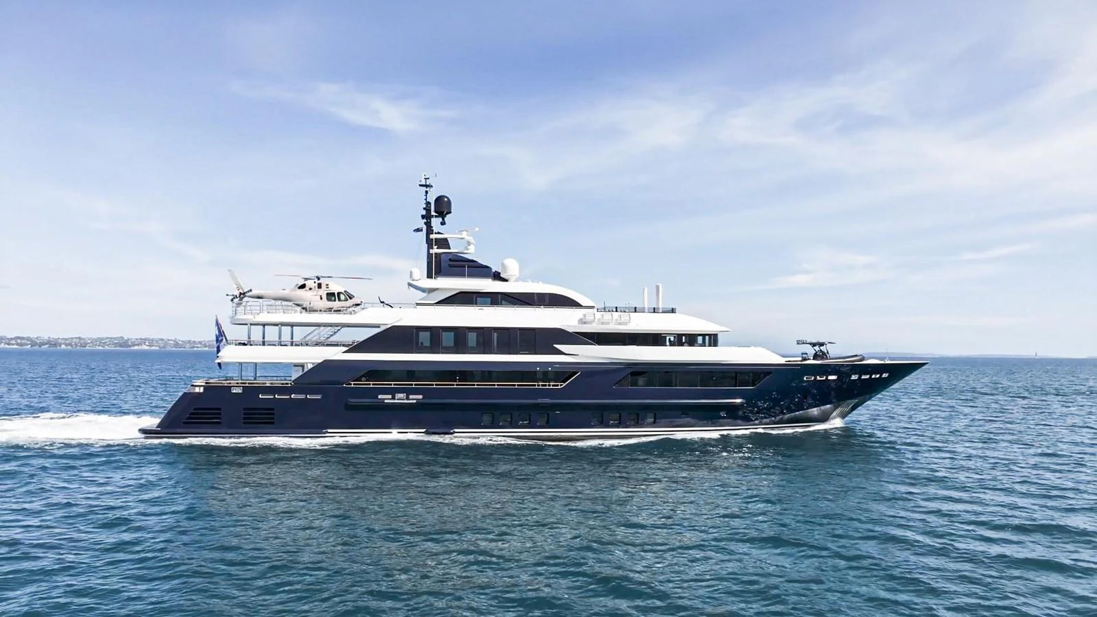 a large white boat on the water aboard ODYSSEY Yacht for Sale