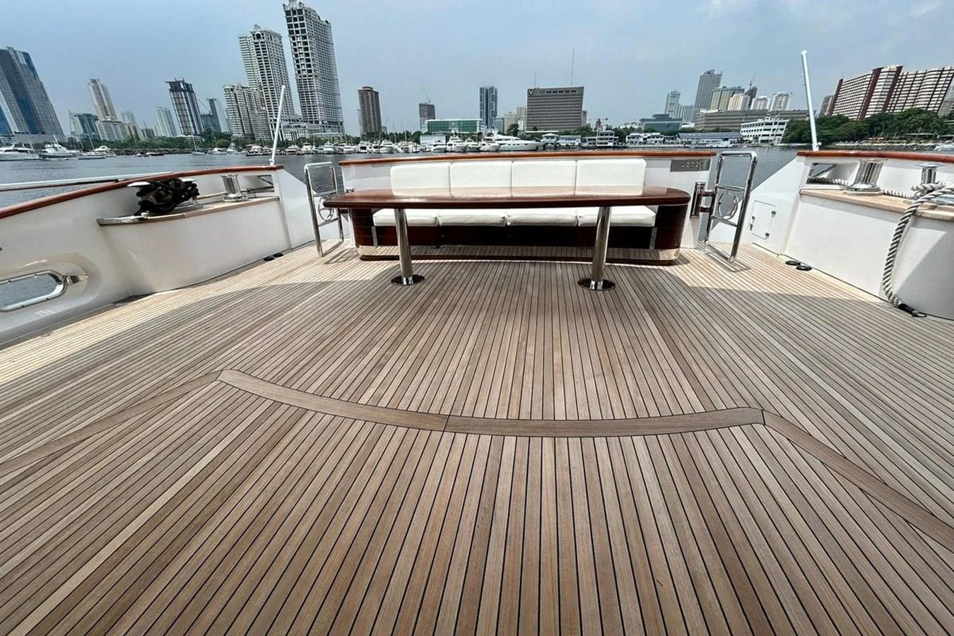 a deck with a view of a city and a river aboard SUNSHINE Yacht for Sale
