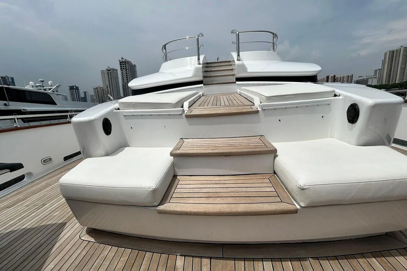 a white boat with a stack of books on it aboard SUNSHINE Yacht for Sale