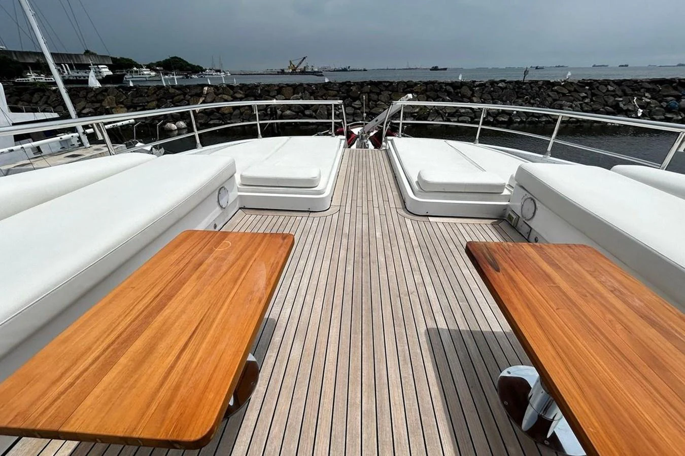 a deck with a view of a city and a large body of water aboard SUNSHINE Yacht for Sale