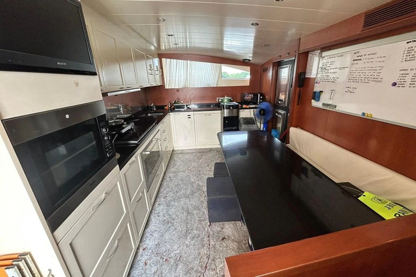 a kitchen with a large island aboard SUNSHINE Yacht for Sale