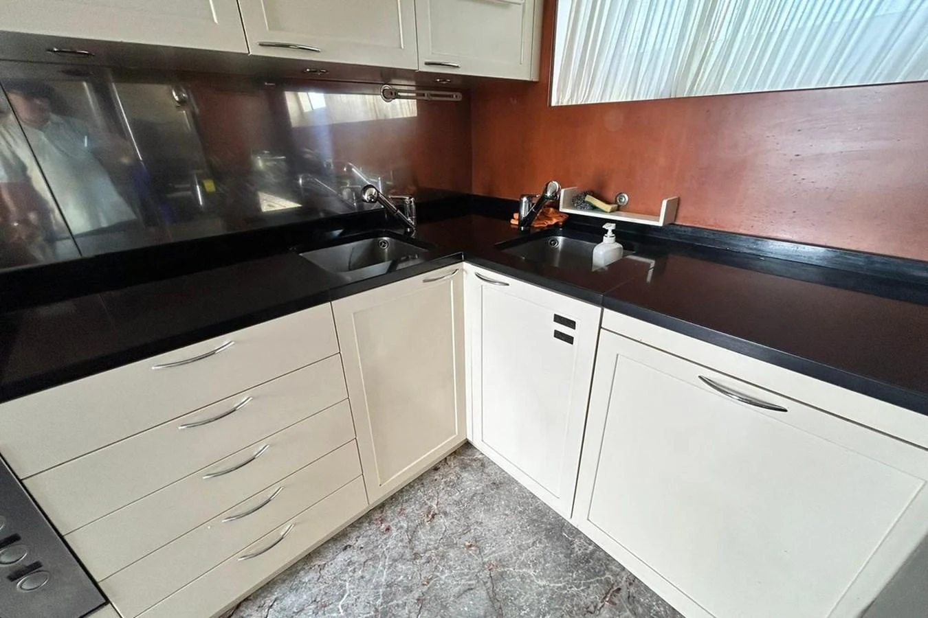 a kitchen with a black counter top aboard SUNSHINE Yacht for Sale