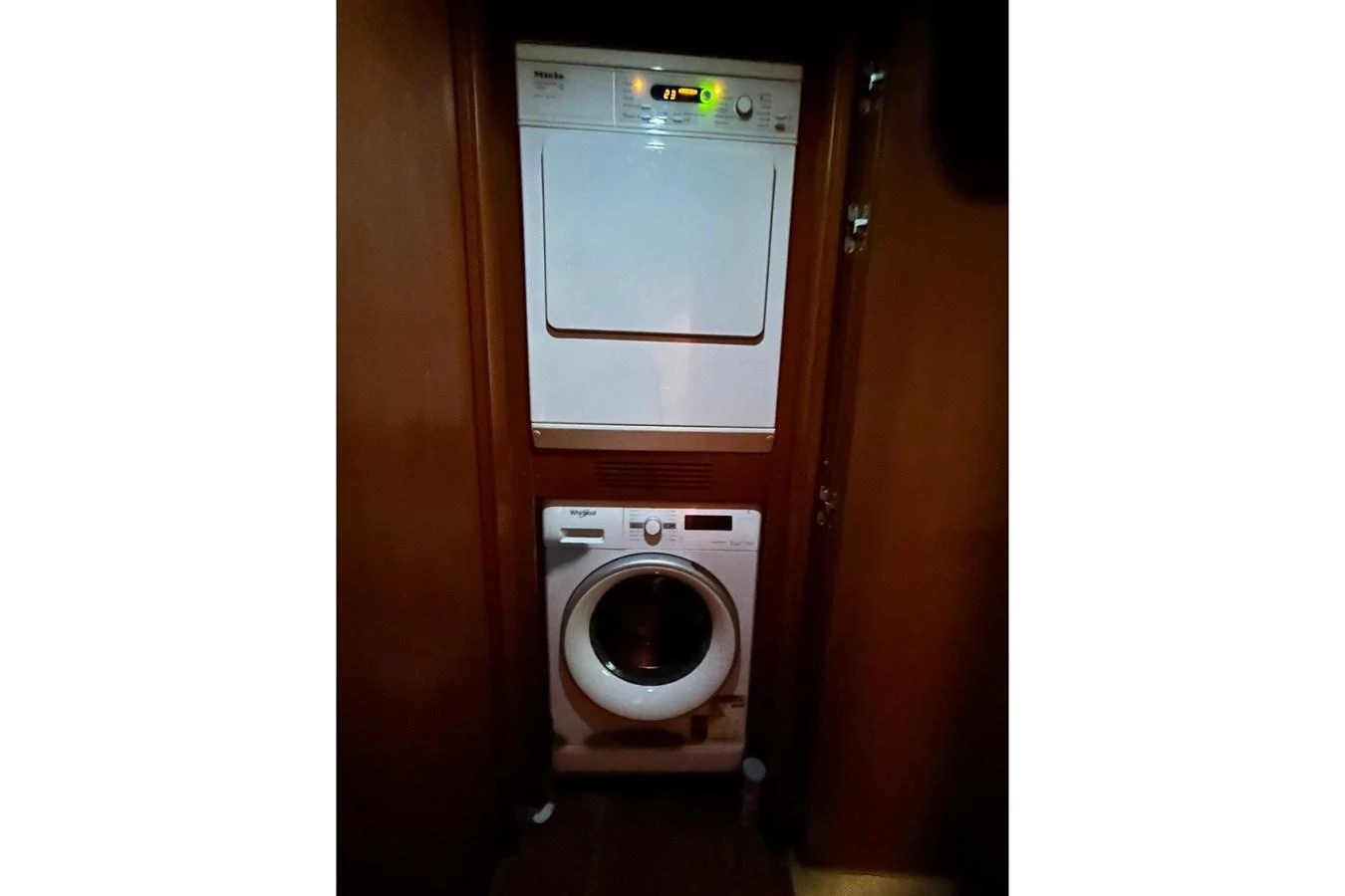 a washing machine in a closet aboard SUNSHINE Yacht for Sale