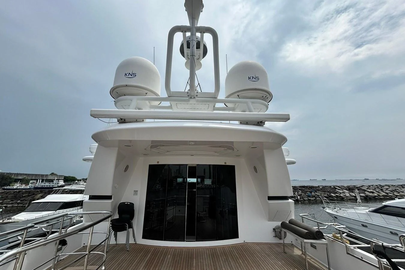 a white boat on a deck aboard SUNSHINE Yacht for Sale