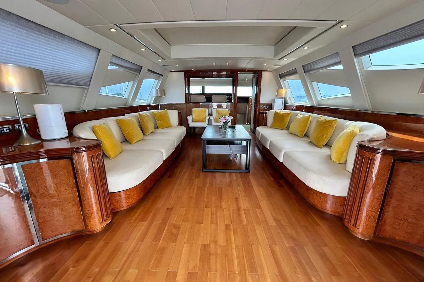 a living room with a couch and a coffee table aboard SUNSHINE Yacht for Sale